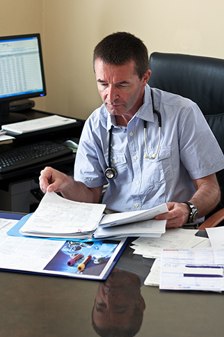 Doctor looking at documents
